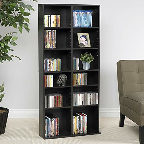 Black media storage shelf with DVDs and decor.